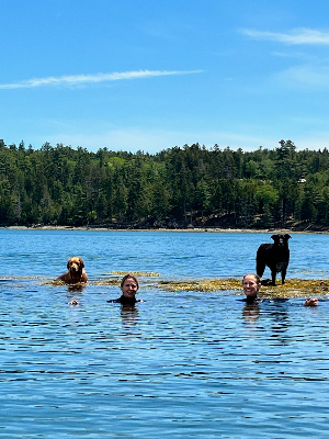 The best part of signing up for the swim is practicing with friends and dog escorts!